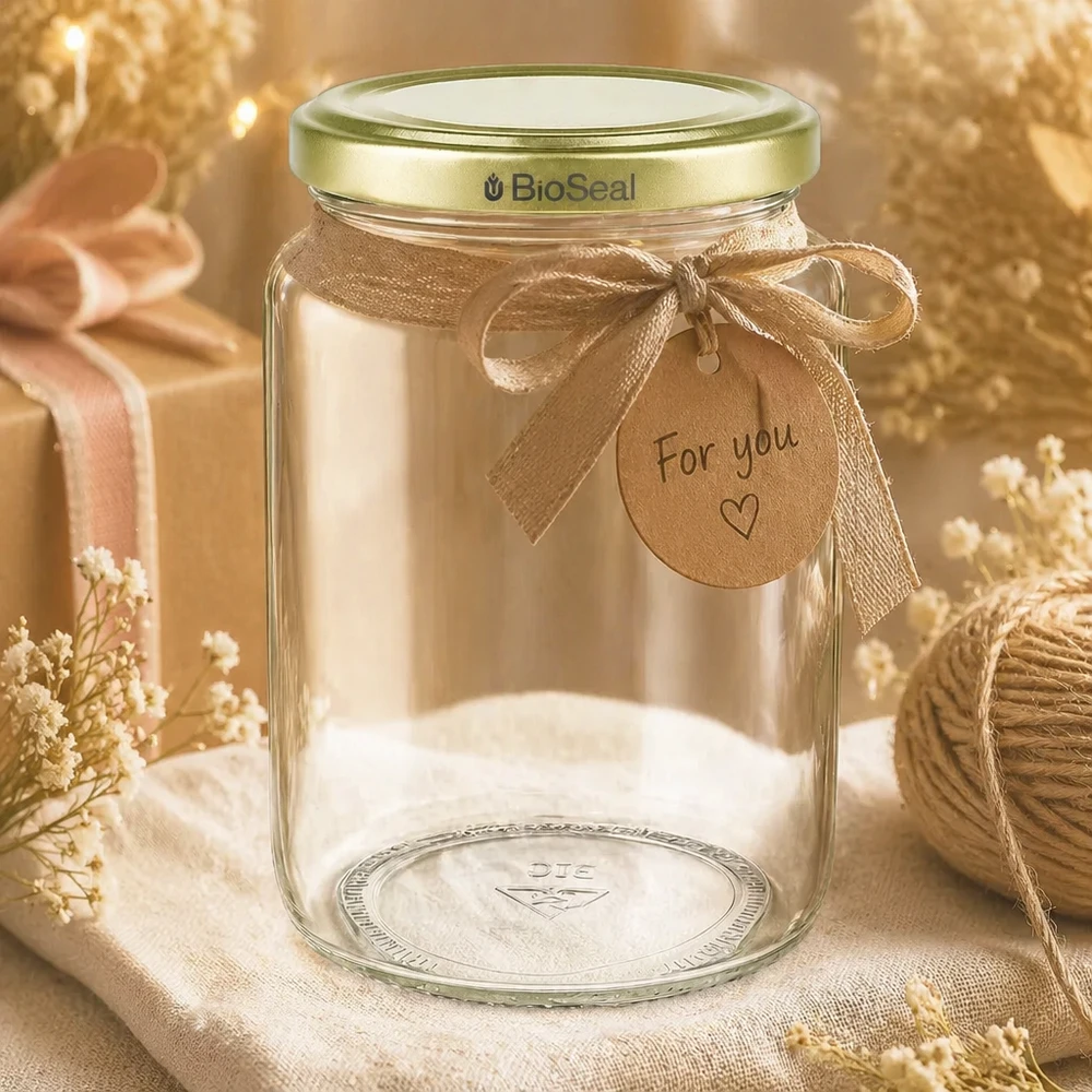 Pot à miel 1000 g avec couvercle doré BioSeal UNiTWIST Pot de miel BioSeal de 1000g à offrir, décoré d'un ruban doré et d'un pendentif de présentation rustique